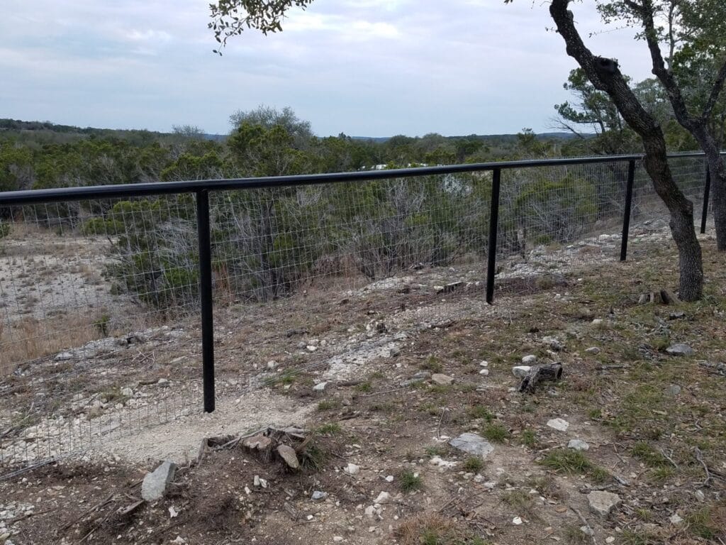 Black pipe rail ranch fence