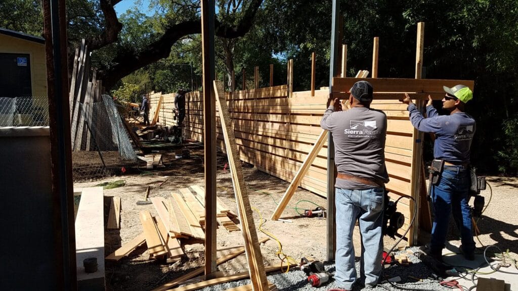 Crews building a custom wood fence
