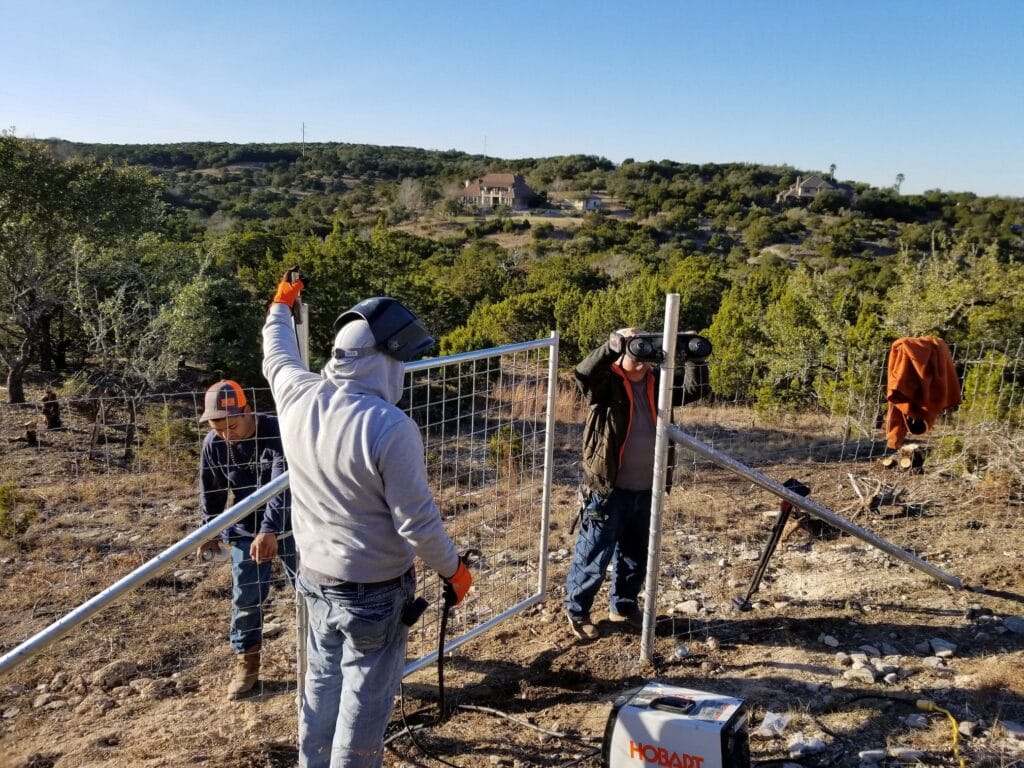 Installation of a gate in a wire ranch fence
