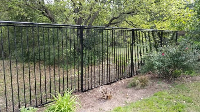 Steel fence with coyote rollers