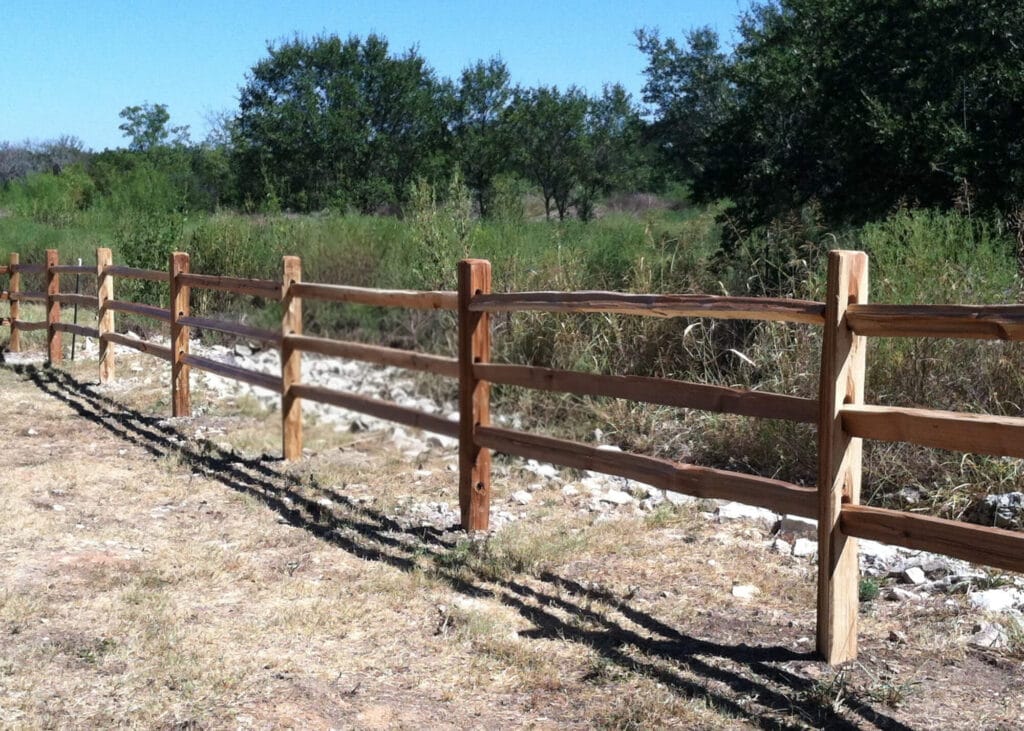Traditional 3-rail cedar split-rail fence.