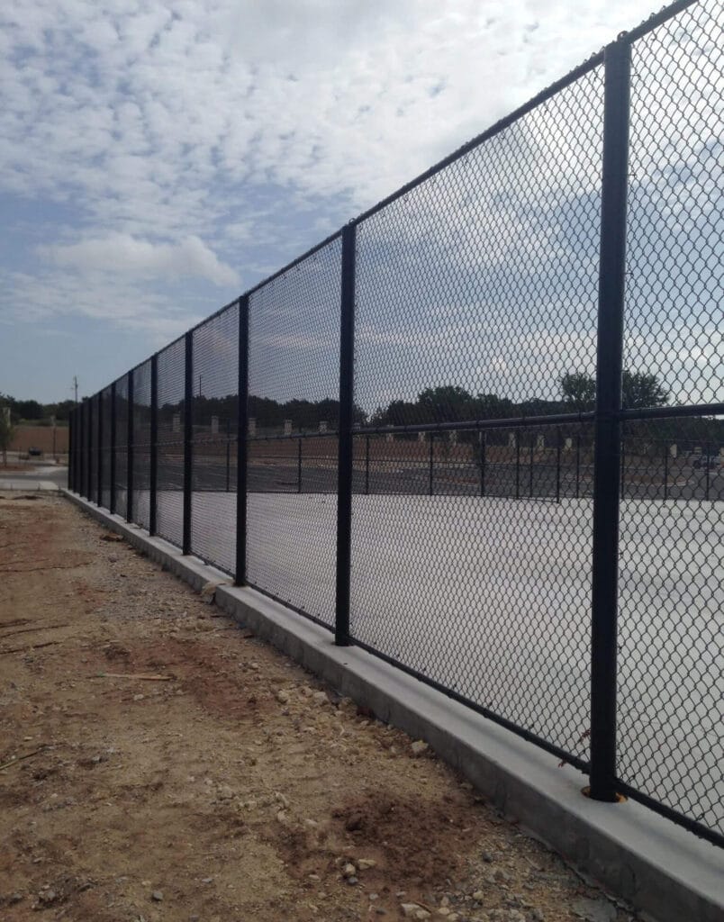 Black vinyl chain-link fence designed for sports courts of all types.