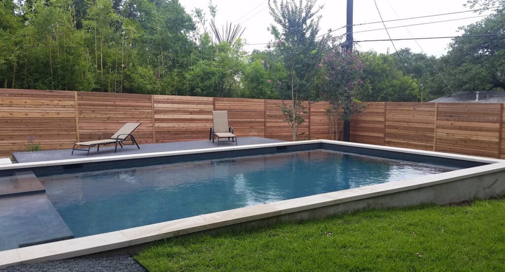 Horizontal privacy fence serving as an alternative pool fence option, installed by Sierra Fence in Central Texas.