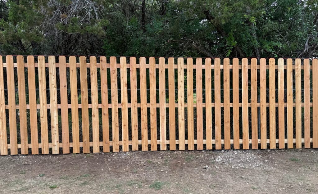 Semi-private cedar fence with wide picket spacing for balanced visibility