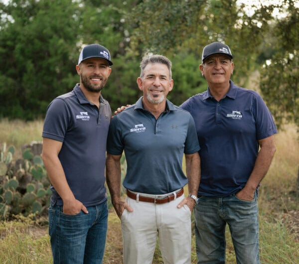 Sierra Fence team members, Richard Novigrod, Christian Mayo, and Hector Rendon, standing together outdoors in Austin Texas