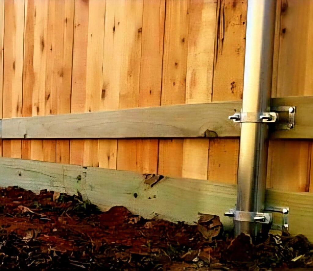 Cedar fence with steel posts and rot board for moisture protection and durability