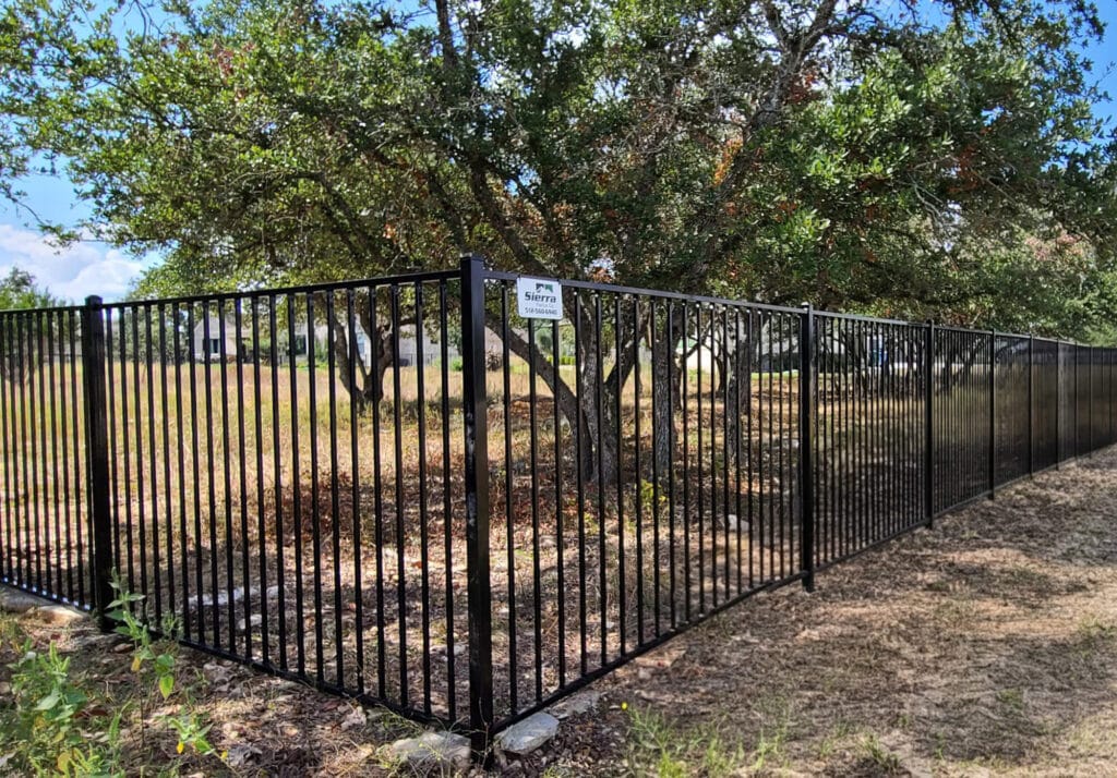 Modern flush-top ornamental steel fence by Sierra Fence