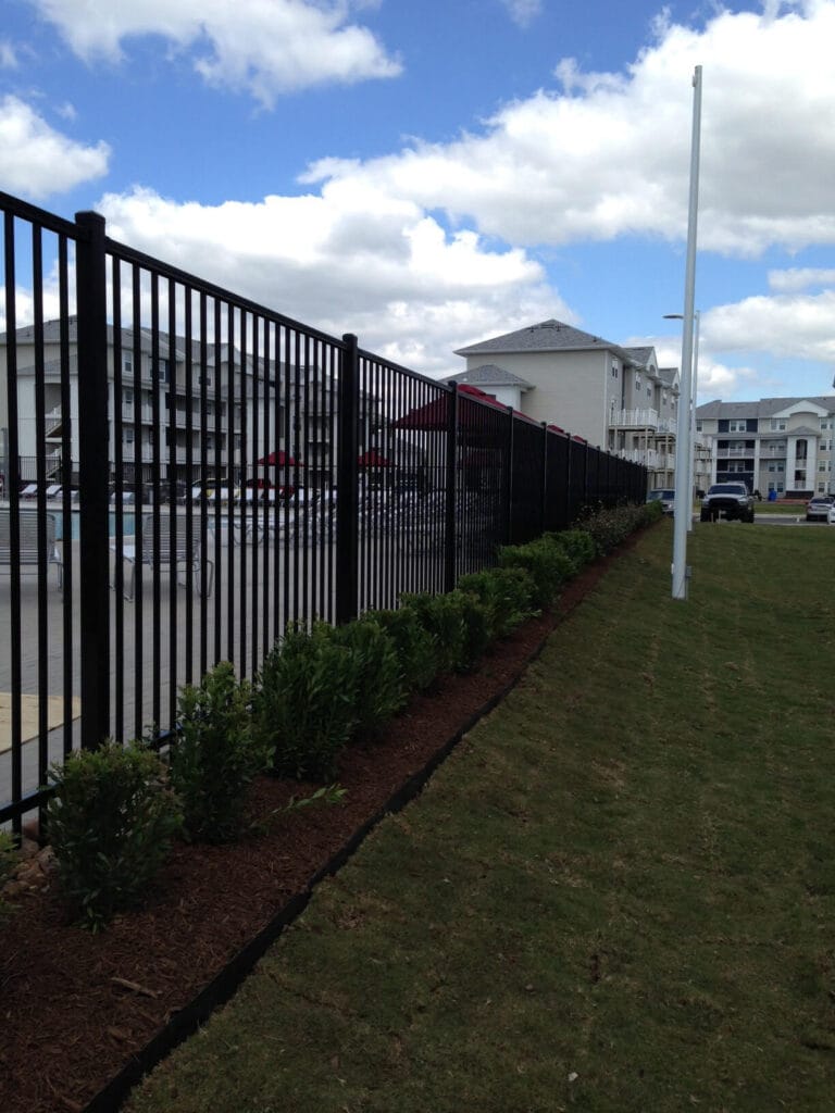 Montage Plus Majestic two-rail ornamental pool fence enclosing apartment amenity area.