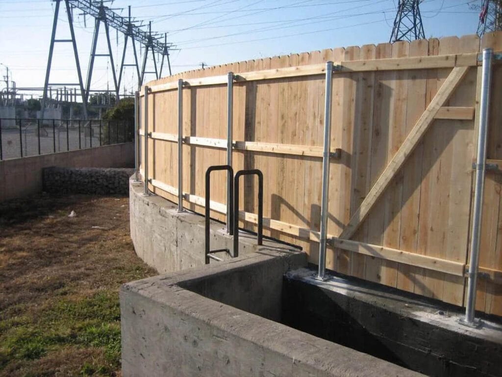 Cedar privacy fence on retaining wall extending height and maintaining seamless look.