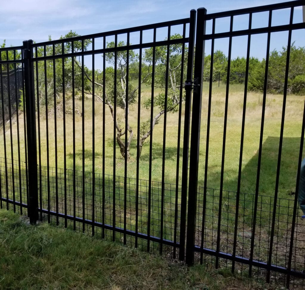 Ornamental steel fence with welded wire bottom for pet and wildlife control