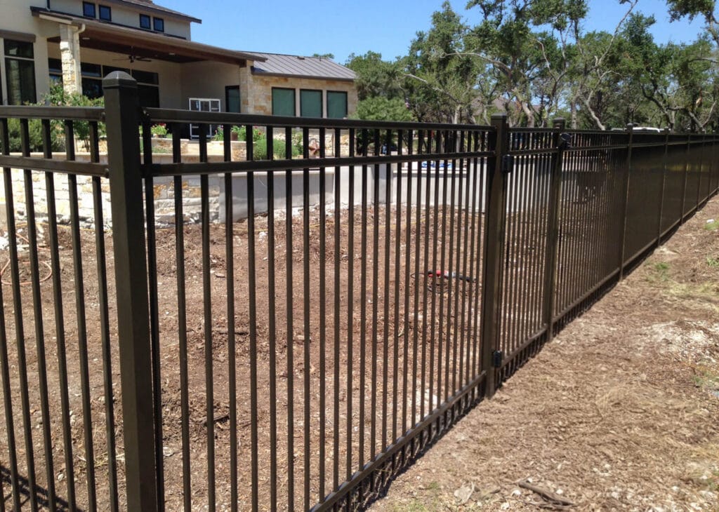 Ornamental steel fence with bronze powder-coat finish