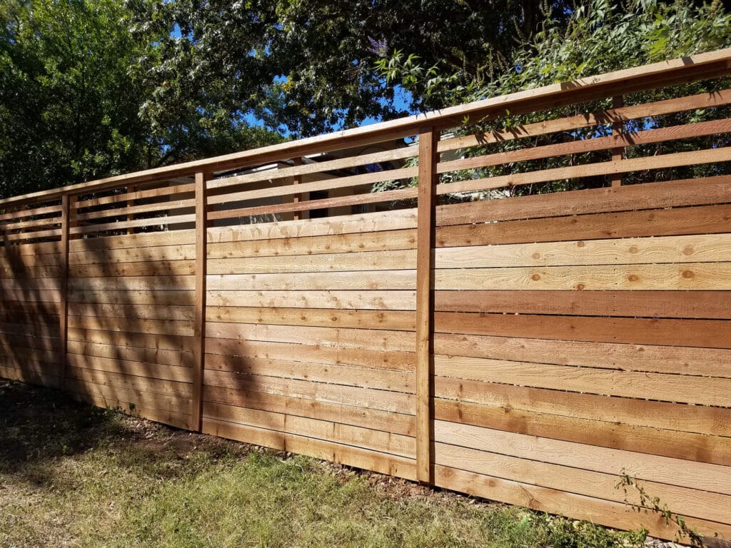 Horizontal cedar fence with slatted top accent for modern curb appeal