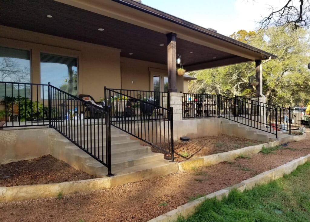Powder-coated iron porch and stair railing matching home architecture