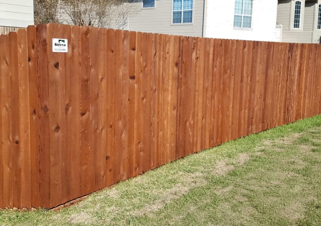 Finished cedar privacy fence with clean lines, rich color, and strong curb appeal