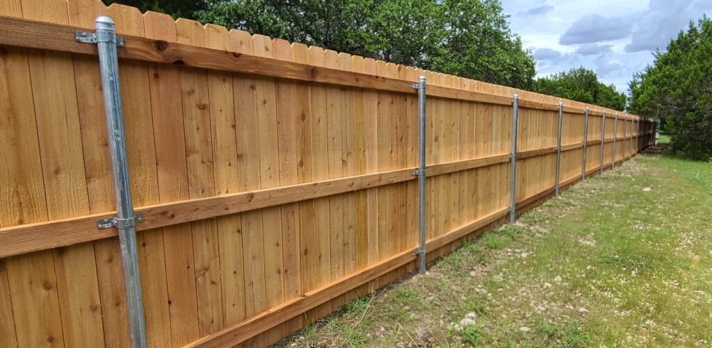 Standard cedar privacy fence built with galvanized steel posts for stability