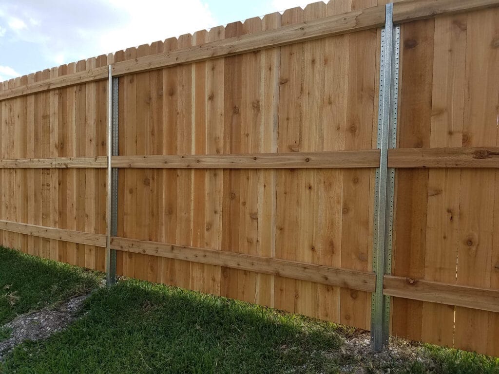 Cedar privacy fence with exposed PostMaster steel posts for a modern look