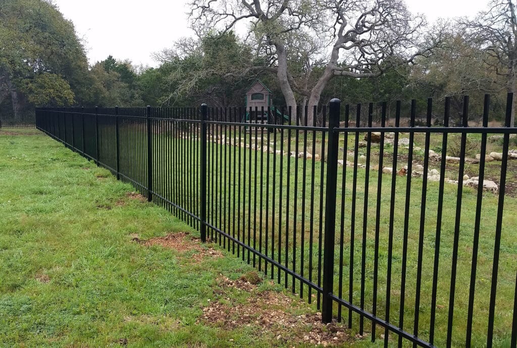 Traditional picket-top steel fence with open-visibility security