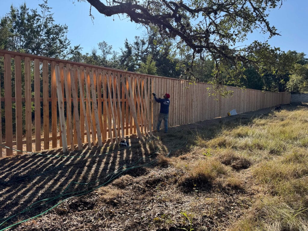 Eight-foot Western Red Cedar fence under construction for added height and privacy