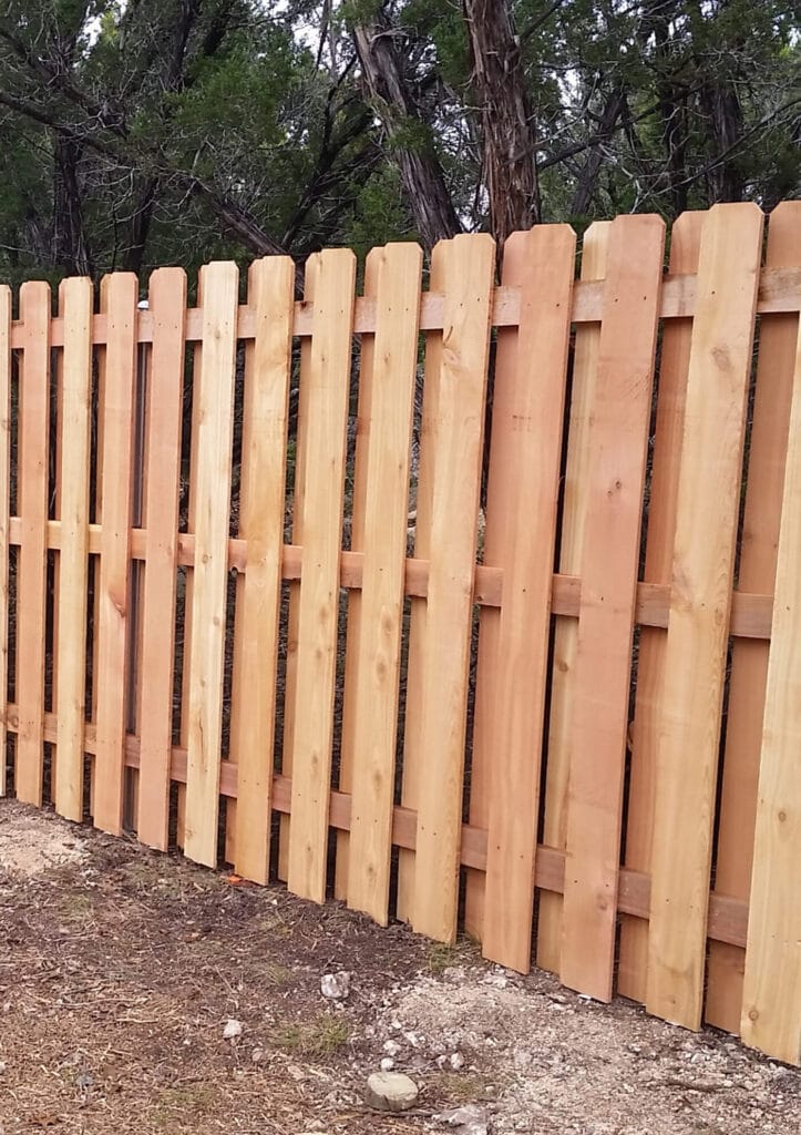 Shadowbox wood fence allowing airflow while maintaining privacy