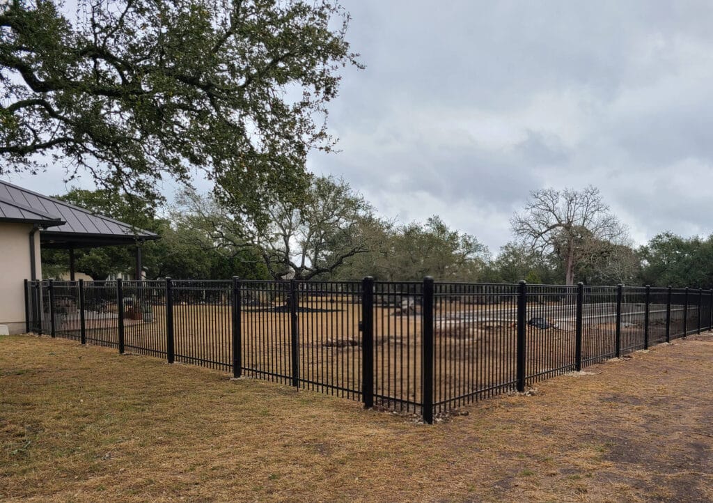 Sturdy ornamental steel fence with thick structural posts